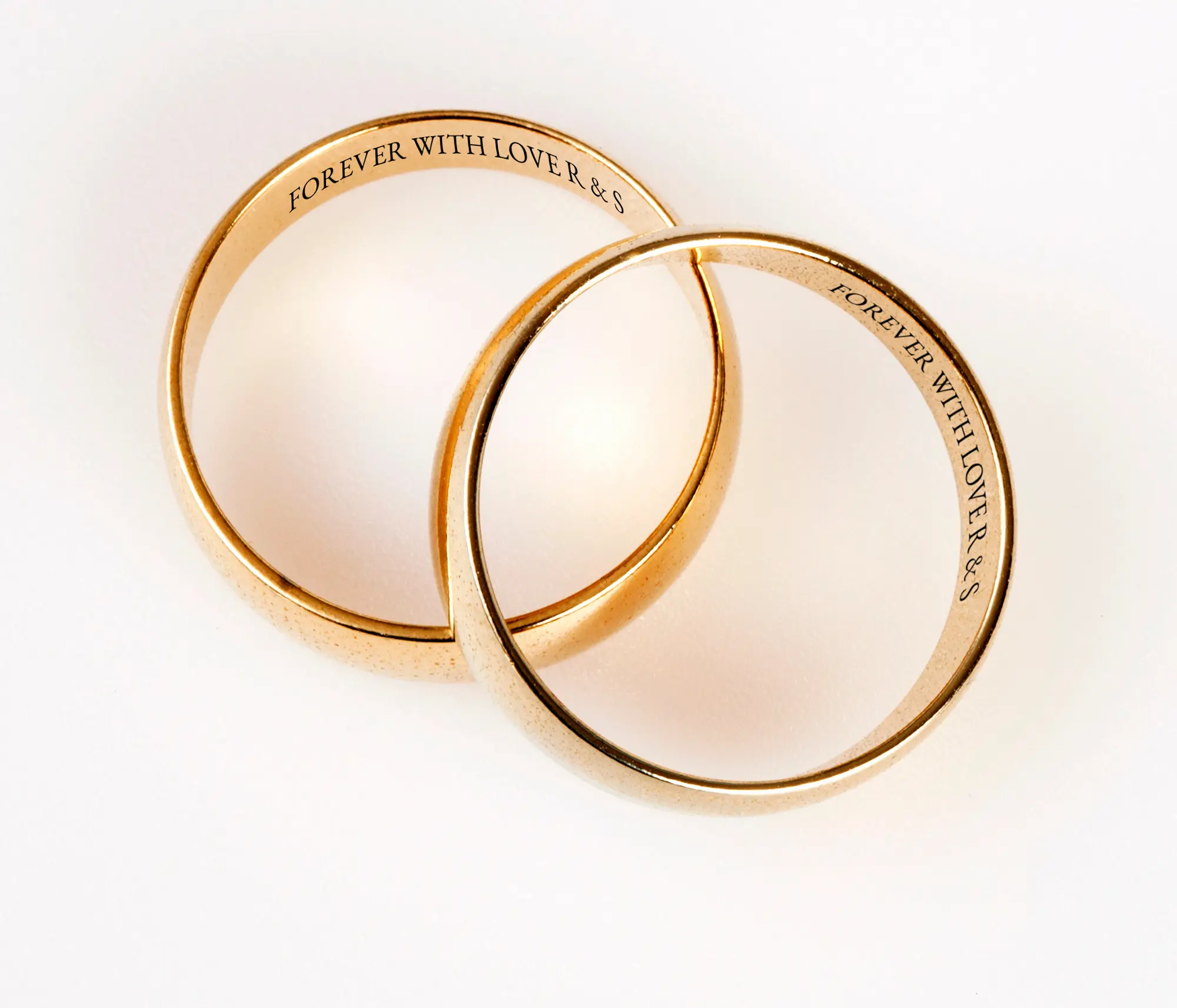 Laser marking system engraving a custom design on a gold ring, ensuring precision and durability for high-end jewelry.