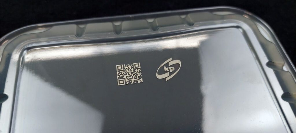 Laser marking on black plastic tray with Macsa ID technology.